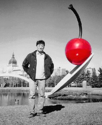  Jeho in front of ''Spoon-bridge & Cherry'' 
at Minneapolis Sculpture Garden, 2000 